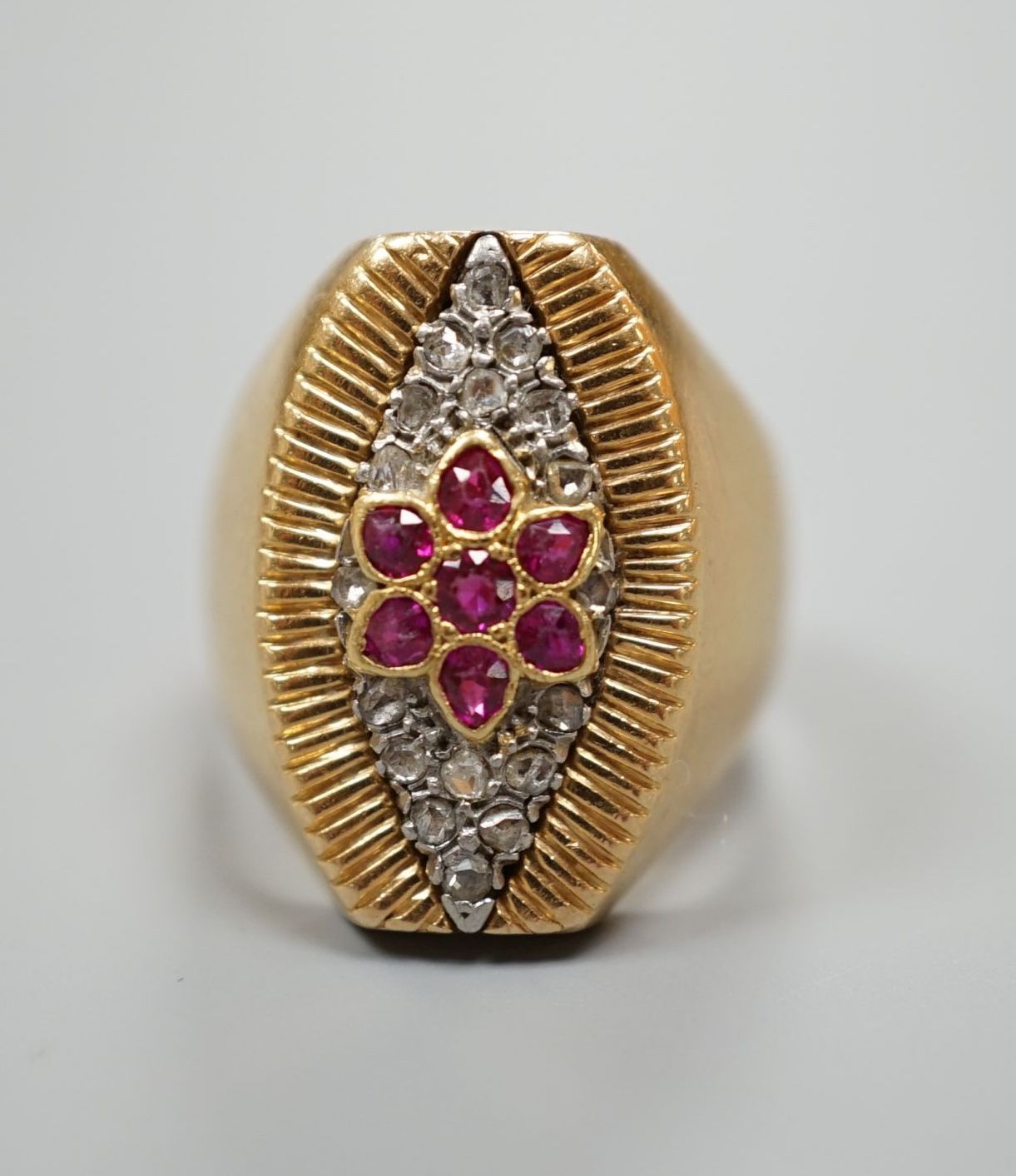 A French yellow metal (18ct poincon mark), ruby and rose cut diamond cluster set marquise shaped dress ring, size M, gross weight 11.3 grams.